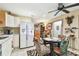 Bright kitchen with white cabinets, stainless steel appliances, and a breakfast nook at 1100 27Th W Ave, Palmetto, FL 34221
