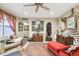 Living room with unique decor, comfortable seating, and large windows at 1100 27Th W Ave, Palmetto, FL 34221