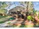Tiki bar with thatch roof and wooden deck at 1100 27Th W Ave, Palmetto, FL 34221