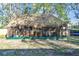 Thatch-roof tiki hut with screened sides at 1100 27Th W Ave, Palmetto, FL 34221
