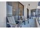 Relaxing balcony with seating, offering access to indoor living space at 1211 Gulf Of Mexico Dr # 403, Longboat Key, FL 34228