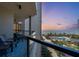 Beachfront balcony with ocean views and seating for two at 1211 Gulf Of Mexico Dr # 403, Longboat Key, FL 34228