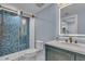 Stylish bathroom with a herringbone tile shower and modern vanity at 1211 Gulf Of Mexico Dr # 403, Longboat Key, FL 34228