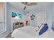 Spacious bedroom with a ceiling fan and views of the ocean at 1211 Gulf Of Mexico Dr # 403, Longboat Key, FL 34228