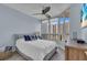 Bright bedroom with a comfortable bed and large windows with ocean view at 1211 Gulf Of Mexico Dr # 403, Longboat Key, FL 34228