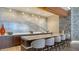 Modern community kitchen with a large island and bar stools at 1211 Gulf Of Mexico Dr # 403, Longboat Key, FL 34228