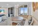 Coastal-themed dining area with ocean views and built-in seating at 1211 Gulf Of Mexico Dr # 403, Longboat Key, FL 34228