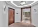 Elegant hallway with hardwood floors and access to elevator at 1211 Gulf Of Mexico Dr # 403, Longboat Key, FL 34228