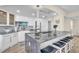 Modern kitchen island with seating and expansive countertops at 1211 Gulf Of Mexico Dr # 403, Longboat Key, FL 34228
