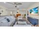 Spacious living area featuring comfortable sofas and a large TV at 1211 Gulf Of Mexico Dr # 403, Longboat Key, FL 34228