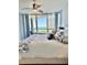 Main bedroom boasts ocean view and comfy bed with stylish bedding at 1211 Gulf Of Mexico Dr # 403, Longboat Key, FL 34228