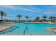 Inviting resort-style pool surrounded by lush tropical landscaping at 1211 Gulf Of Mexico Dr # 403, Longboat Key, FL 34228