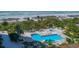 Aerial view of refreshing pool area with beach access at 1211 Gulf Of Mexico Dr # 403, Longboat Key, FL 34228