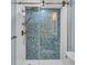 Modern shower with herringbone patterned tile and glass enclosure at 1211 Gulf Of Mexico Dr # 403, Longboat Key, FL 34228