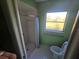 Small bathroom with shower and toilet at 1346 Kenmore St, Port Charlotte, FL 33952