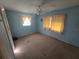Bedroom with light blue walls and carpeted floor at 1346 Kenmore St, Port Charlotte, FL 33952
