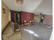 Living room with tiled floor, and two armchairs at 1346 Kenmore St, Port Charlotte, FL 33952