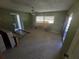 Main bedroom with tiled floors and a window at 1346 Kenmore St, Port Charlotte, FL 33952