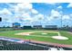 Baseball field with seating and scoreboard at 1447 Allegheny Ln, North Port, FL 34286
