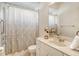 Clean bathroom with shower/tub combo and white vanity at 1447 Allegheny Ln, North Port, FL 34286