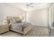 Spacious bedroom with wood-look floors and a ceiling fan at 1447 Allegheny Ln, North Port, FL 34286