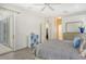Main bedroom with sliding doors to the patio and en-suite bathroom at 1447 Allegheny Ln, North Port, FL 34286