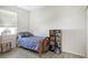 Simple bedroom with wood-look floors and built-in shelving at 1447 Allegheny Ln, North Port, FL 34286