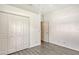 Bright bedroom with double door closet and wood-look floors at 1447 Allegheny Ln, North Port, FL 34286