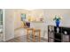Open concept kitchen with breakfast bar and view into the dining area at 1447 Allegheny Ln, North Port, FL 34286