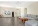 Living room with gray sectional sofa and coffee table at 1447 Allegheny Ln, North Port, FL 34286