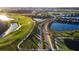 Aerial view of Lakewood National showcasing roads, lakes and golf course at 17607 Gawthrop Dr # 103, Bradenton, FL 34211