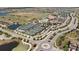 Community clubhouse with tennis courts and pool visible from above at 17607 Gawthrop Dr # 103, Bradenton, FL 34211