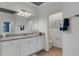 Elegant bathroom with a double vanity and granite countertops at 17607 Gawthrop Dr # 103, Bradenton, FL 34211