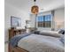 Bedroom with twin beds, rustic dresser, and accents at 17607 Gawthrop Dr # 103, Bradenton, FL 34211