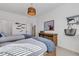 Bedroom with twin beds and rustic wood furniture at 17607 Gawthrop Dr # 103, Bradenton, FL 34211