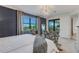 Bright bedroom with a king-size bed and access to a balcony at 17607 Gawthrop Dr # 103, Bradenton, FL 34211