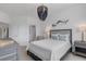 Bedroom with queen bed, closet, and decorative accents at 17607 Gawthrop Dr # 103, Bradenton, FL 34211