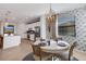 Bright dining area with a round table and stylish wall decor at 17607 Gawthrop Dr # 103, Bradenton, FL 34211
