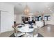 Dining area with round table and chairs, decorative wallpaper, and chandelier at 17607 Gawthrop Dr # 103, Bradenton, FL 34211