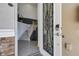 Front entry with glass and metal door leading to staircase at 17607 Gawthrop Dr # 103, Bradenton, FL 34211