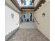 Inviting entryway with double doors and a brick-paved walkway at 17607 Gawthrop Dr # 103, Bradenton, FL 34211
