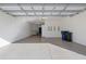 Open garage with epoxy flooring and storage solutions at 17607 Gawthrop Dr # 103, Bradenton, FL 34211