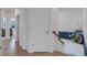 A bright hallway with tile flooring and doors leading to other rooms at 17607 Gawthrop Dr # 103, Bradenton, FL 34211