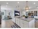Modern kitchen with white cabinets, granite countertops, and stainless steel appliances at 17607 Gawthrop Dr # 103, Bradenton, FL 34211