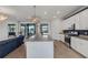 Open concept kitchen with island, stainless steel appliances, and granite countertops at 17607 Gawthrop Dr # 103, Bradenton, FL 34211