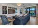 Comfortable living room with built-in shelving and blue sofa at 17607 Gawthrop Dr # 103, Bradenton, FL 34211