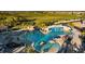 Relaxing pool with a rock waterfall feature at 17607 Gawthrop Dr # 103, Bradenton, FL 34211