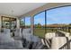 Spacious screened balcony with seating area and view at 17607 Gawthrop Dr # 103, Bradenton, FL 34211
