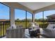 Peaceful screened balcony with seating area and view at 17607 Gawthrop Dr # 103, Bradenton, FL 34211
