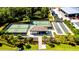 Modern tennis and pickleball courts with a covered seating area at 17607 Gawthrop Dr # 103, Bradenton, FL 34211